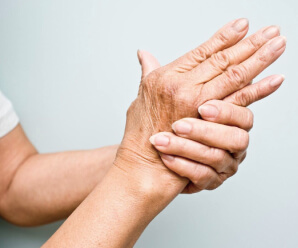 Woman experiencing hand and wrist stiffness