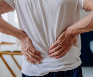 Man experiencing back discomfort