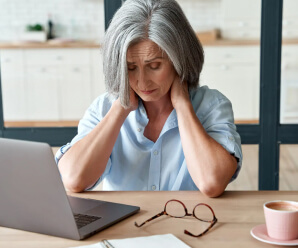 Woman experiencing neck stiffness